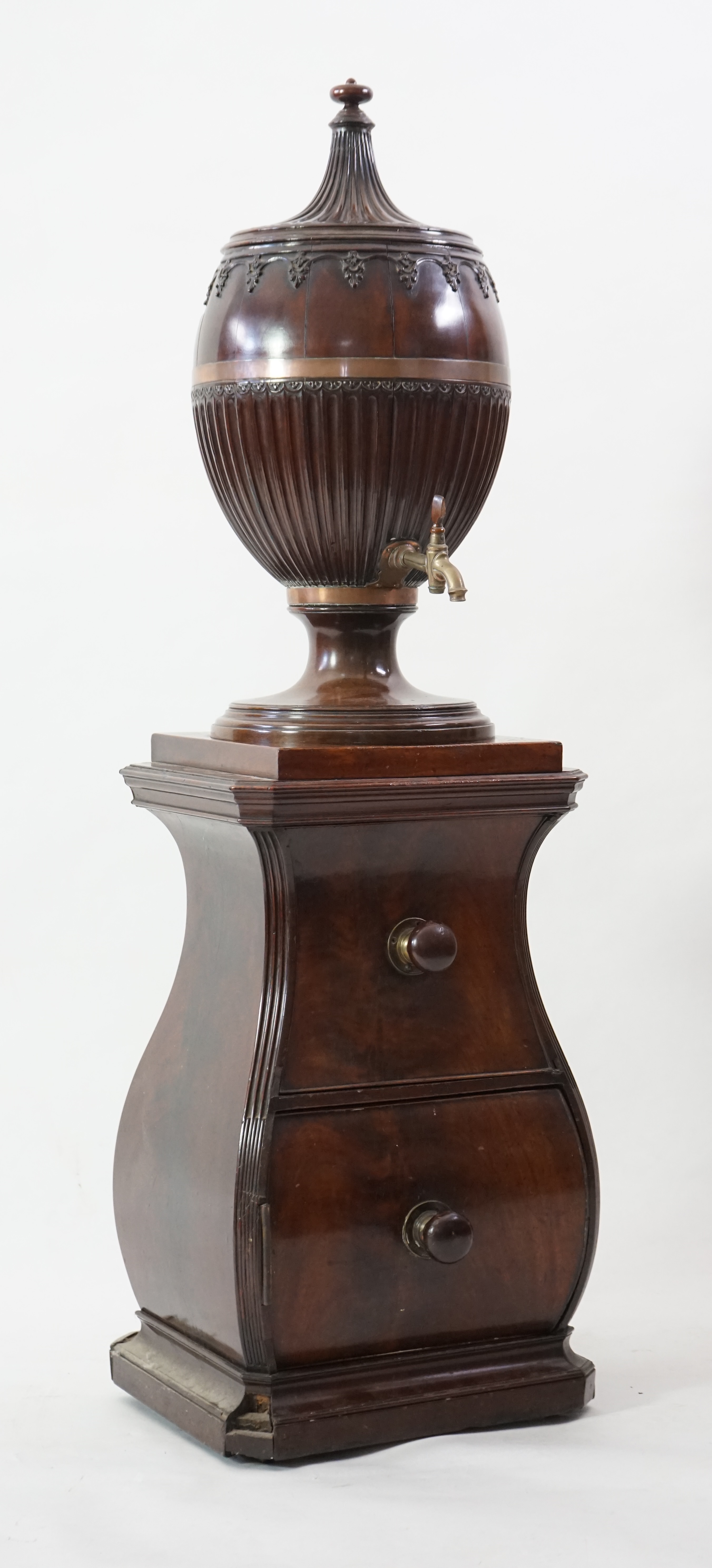 An 18th century Dutch carved mahogany wine cooler and cover